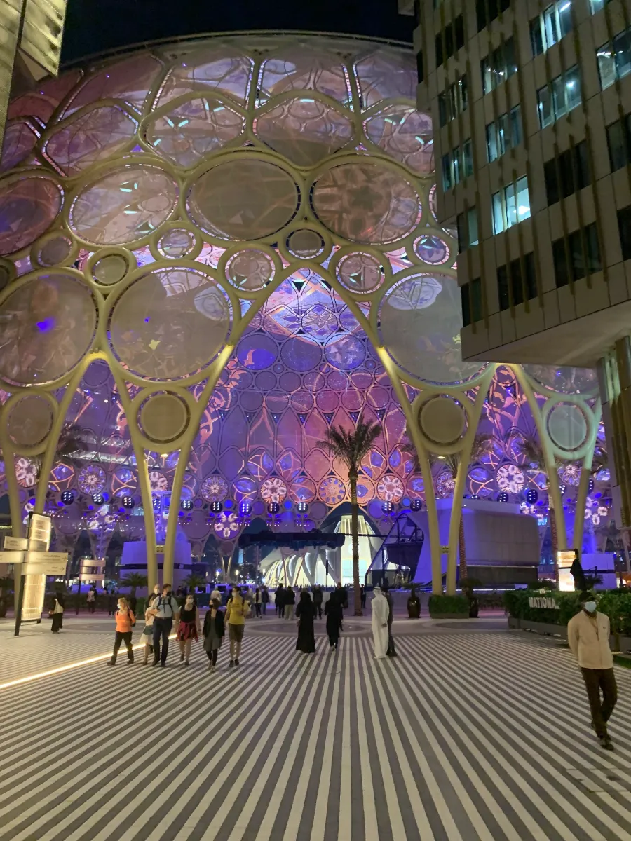 Al Wasl Plaza dome at Expo City Dubai, next to Dubai South, lit up in the evening